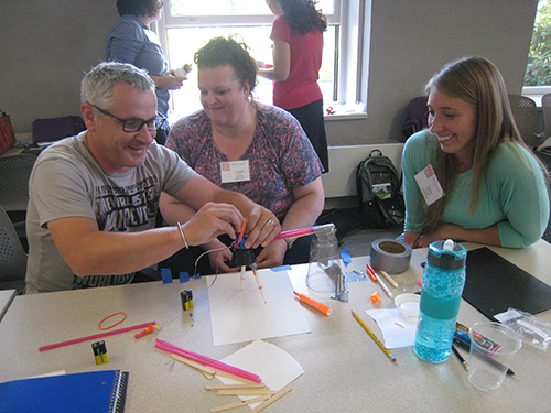 3 teachers working on an activity at First-Year Teacher Workshop