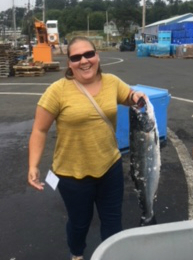 Teacher holding large fish