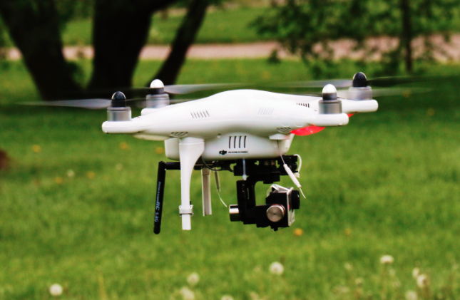 An image of a drone that has barely taken off the ground. 