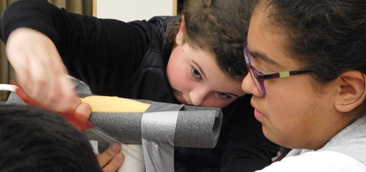 SMILE students work together at challenge on project